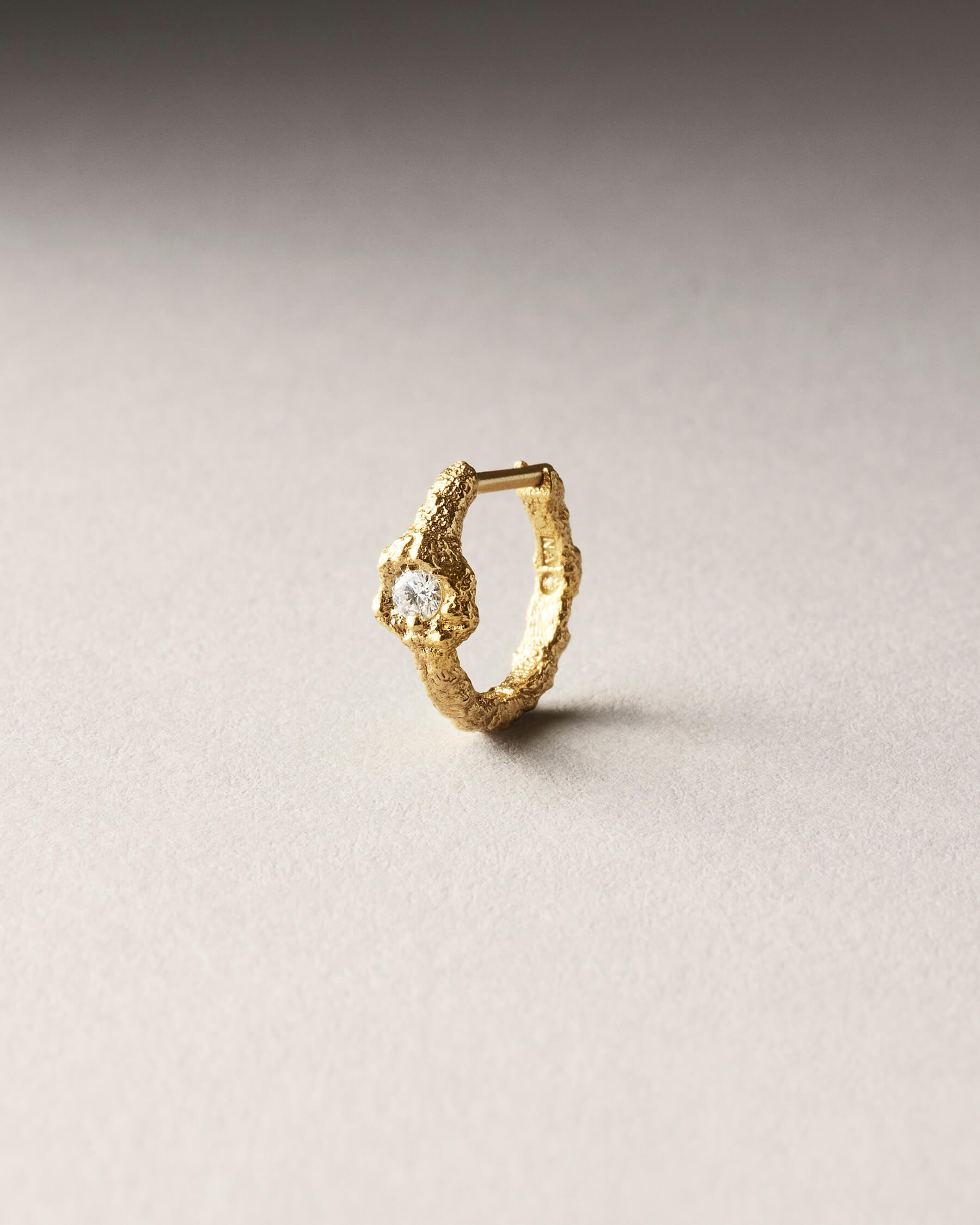 Gold hoop with a diamond
