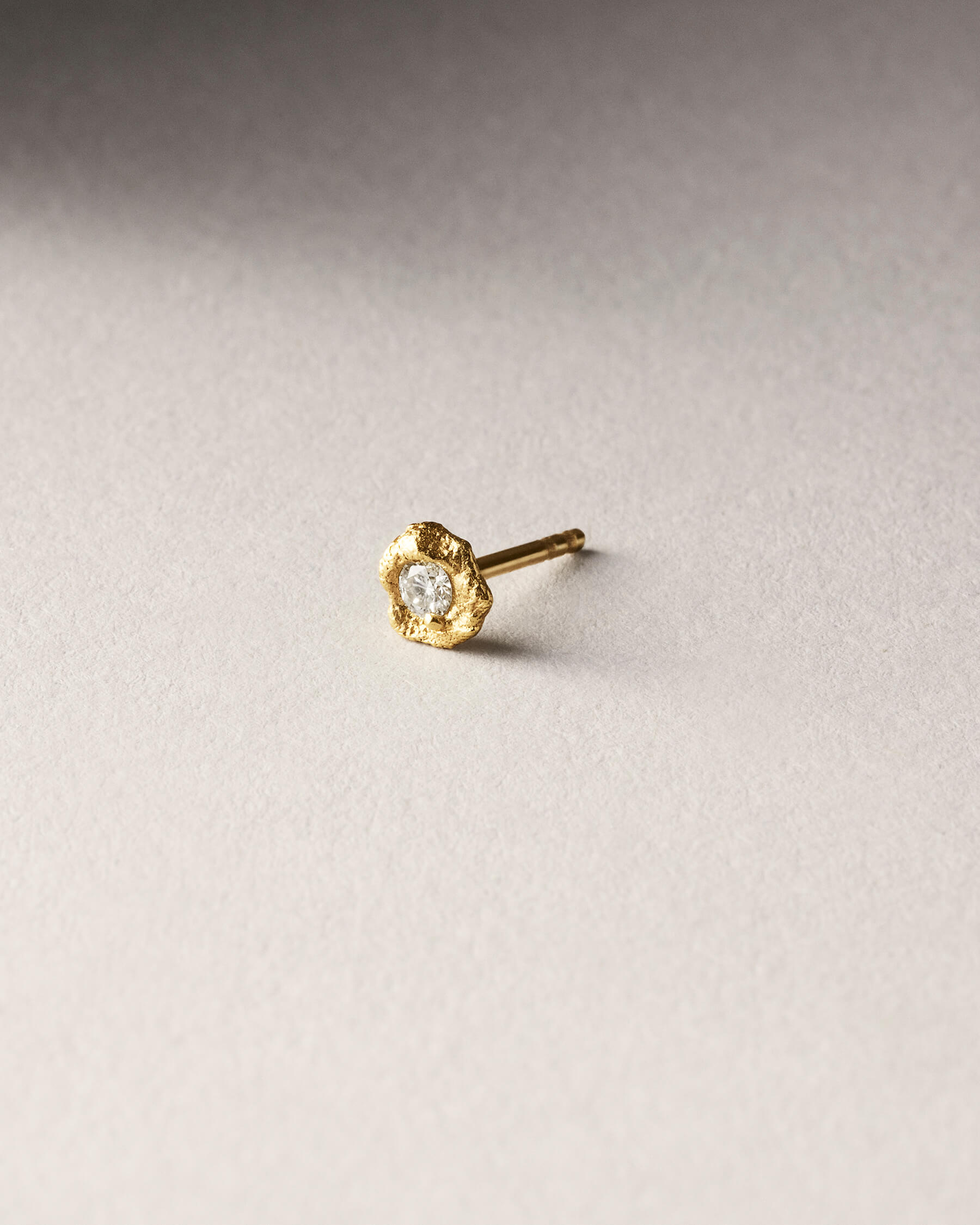 Raw stud with diamond